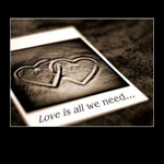 Аватар Открытка с двумя сердцами на песке и надписью «Love is all you need...»