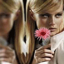Аватар Девушка с цветком рядом с зеркалом