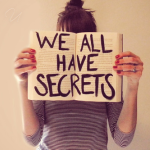 99px.ru аватар Девушка держит раскрытую книгу с надписью WE ALL HAVE SECRETS