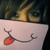99px.ru аватар Девушка держит у рта бумажку с нарисованной на ней улыбкой и высунутым языком