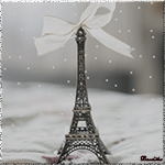 99px.ru аватар Игрушечная эйфелевая башня / la tour Eiffel с бантиком стоит на фоне падающего снега