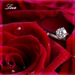 99px.ru аватар Кольцо с камнем лежит в ярко-красных розах, на которых блестят капли воды (Love / Любовь)