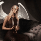 99px.ru аватар Девушка с белыми крыльями сидит на диване с кубком в руке
