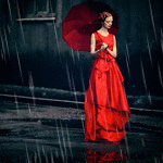 99px.ru аватар Девушка в красном платье с зонтом стоит на дороге под дождем