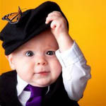 99px.ru аватар Мальчик с серыми глазами в белой рубашке, сиреневом галстуке в кепке с сидящей на ней бабочке