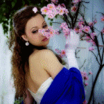 99px.ru аватар Девушка стоит у цветущей ветки сакуры