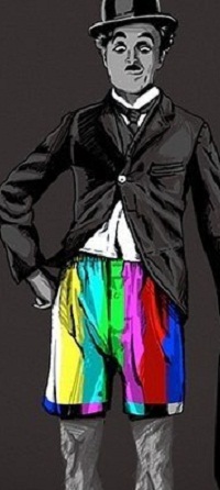 99px.ru аватар Charlie Chaplin / Чарли Чаплин на черном фоне стоит в полосатых разноцветных шортах и смотрит вниз