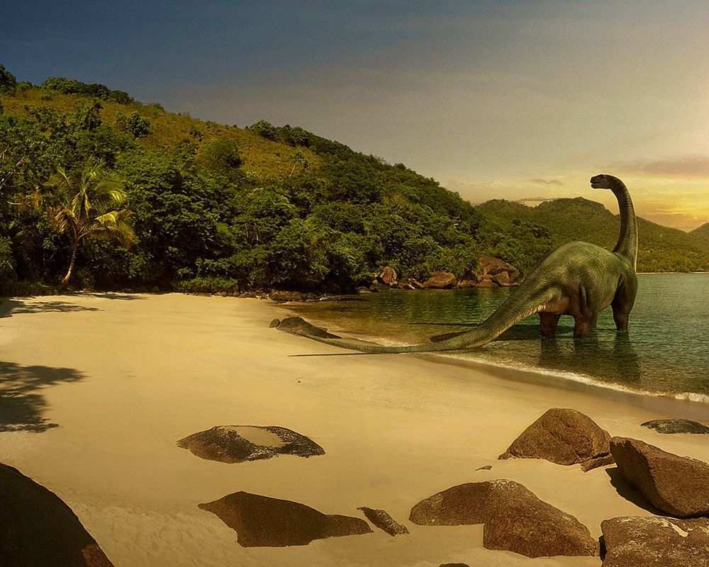 Обои для рабочего стола Динозавр загорает на берегу моря