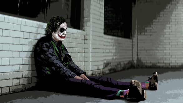 Обои на рабочий стол Грустный Джокер из фильма Бэтмен: Темный рыцарь / The Dark Knight сидит у кирпичной стены