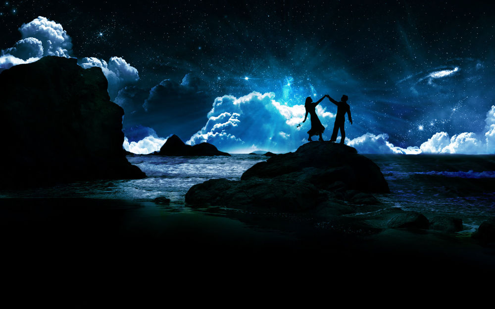 Обои для рабочего стола Влюбленная пара танцует на камне возле моря ночью под фантастическим звездным небом