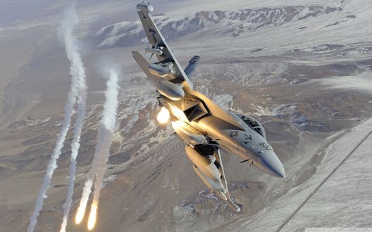 Обои на рабочий стол Истребитель F-18 выпустил ракеты
