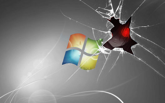 Обои на рабочий стол Через трещину в разбитом экране windows выглядывает жуткая девушка со светящимся красным глазом измазанная в крови