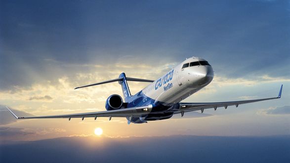 Обои на рабочий стол Летящий самолёт Bombardier CRJ1000 / Бомбадир