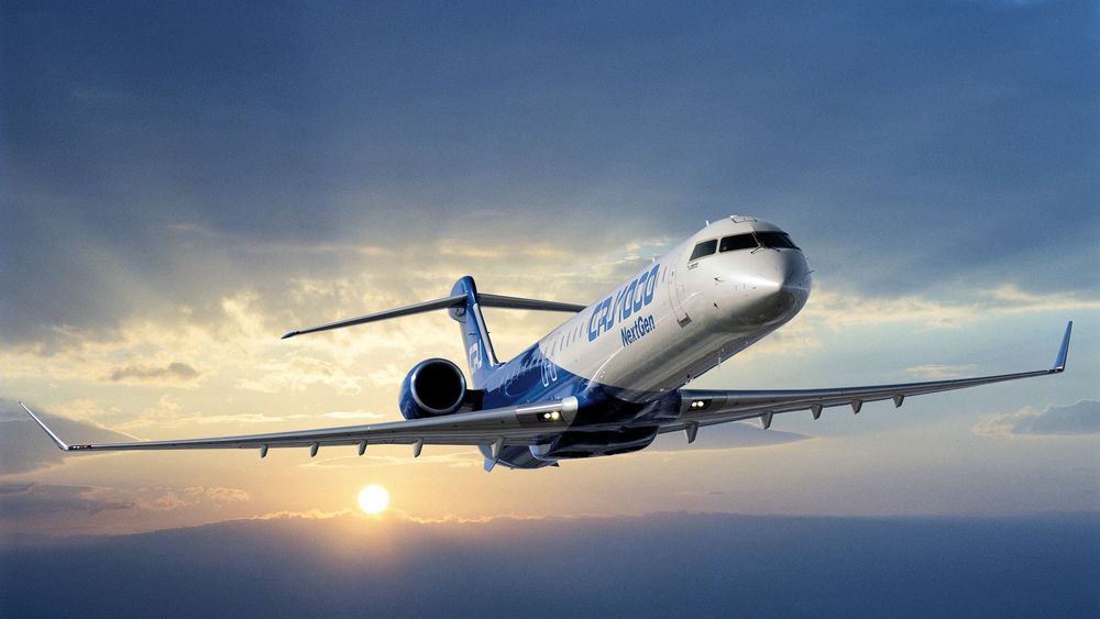 Обои для рабочего стола Летящий самолёт Bombardier CRJ1000 / Бомбадир