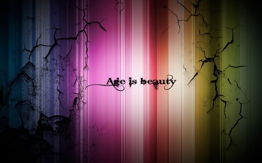 Обои на рабочий стол Надпись Age is beauty / Возраст это красота на потрескавшемся цветном фоне