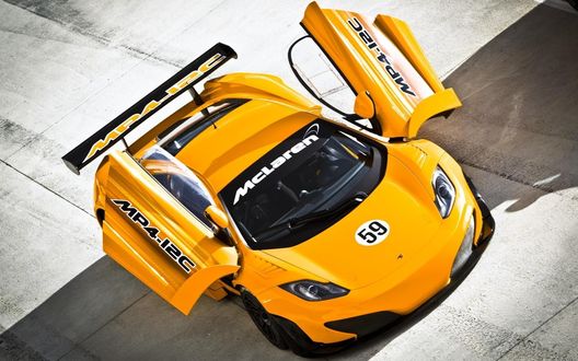 Обои на рабочий стол Mclaren MP4-12C / Мсларен МР4-12С с открывающимися дверьми в вверх