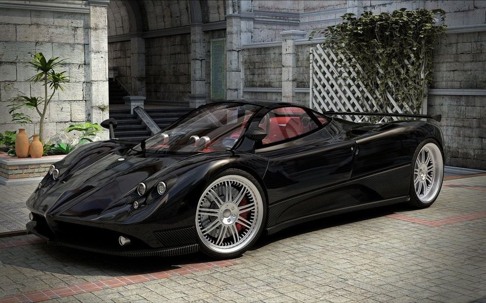 Обои для рабочего стола Черный спорткар Pagani Zonda / Пагани Зонда с открытым верхом стоит у дома