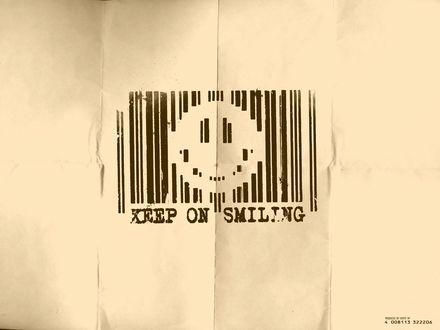 Обои на рабочий стол Штрихкод со смайлом на мятой бумаге (Keep on smiling / Продолжайте улыбаться)