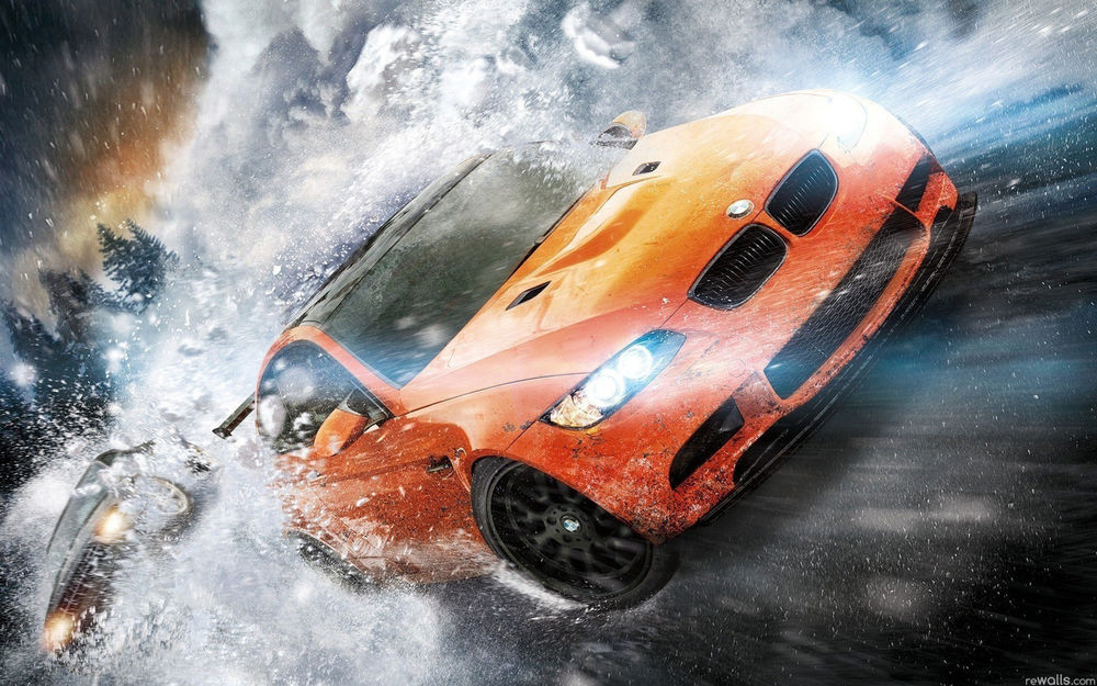 Обои для рабочего стола Обои к игре Need for Speed: the Run / Жажда Скорости: Беги оранжевая BMW W3 / БМВ В3 мчится по шоссе занесенному снегом