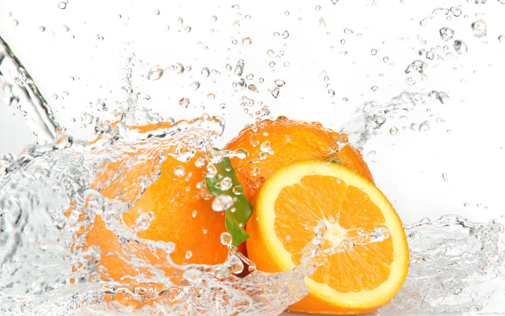 Обои для рабочего стола Брызги от апельсинов