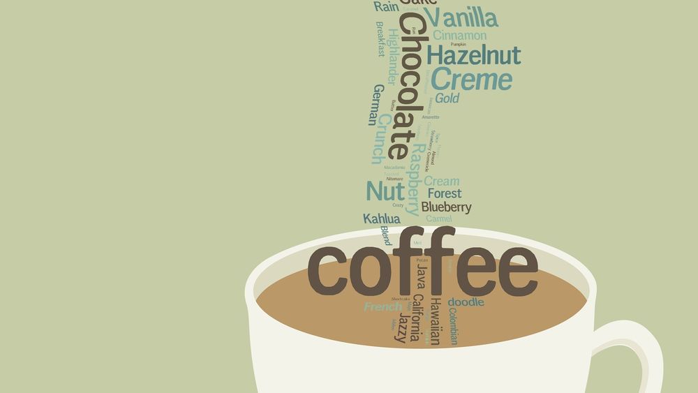 Обои для рабочего стола Белая кружка кофе из которой вылетают слова (coffe, chocolate, creme. hazelnut, vanilla.)