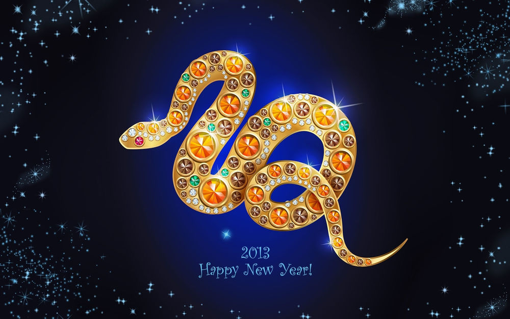 Обои для рабочего стола Надпись Happy New Year 2013 / Счастливого нового года 2013 на синем фоне вместе с золотистой змеей, покрытой камнями