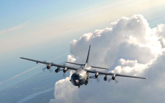 Обои на рабочий стол Полет огромного самолета Lockheed AC-130 сквозь облака