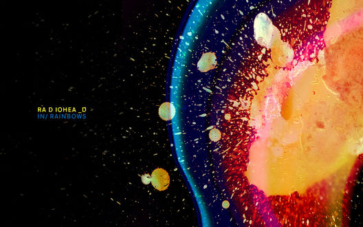 Обои на рабочий стол Цветные брызги на черном фоне (Radiohead in rainbows), обложка альбома группы Radiohead