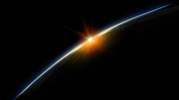 Обои на рабочий стол Восход солнца снятый из космоса