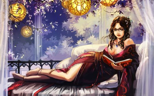 Обои на рабочий стол Девушка лежит на диване и читает книгу
