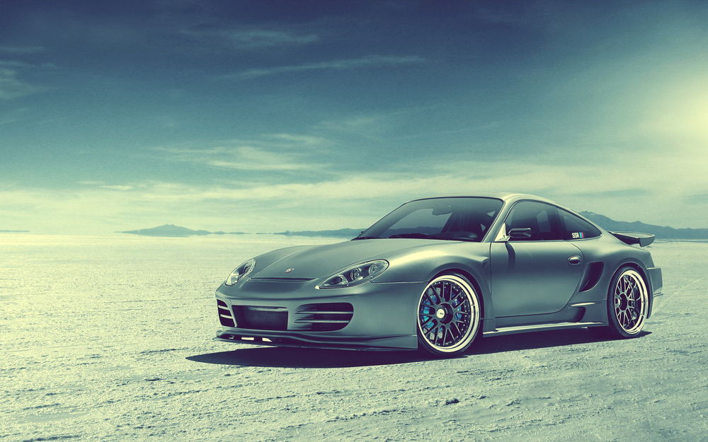 Обои для рабочего стола Спортивная машина Porsche 996 / Порш 996 на фоне неба