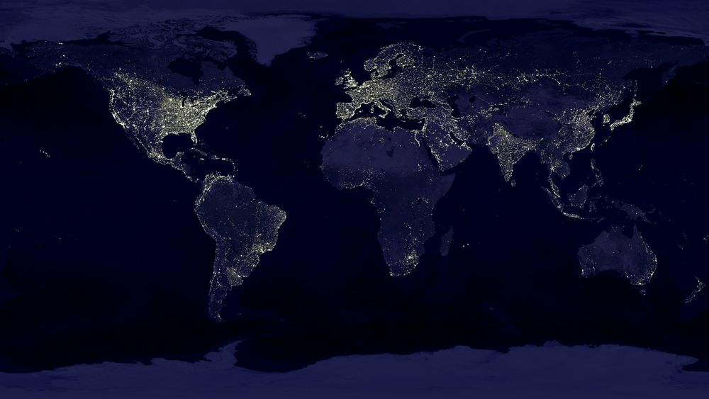 Обои для рабочего стола Карта Земли из космоса ночью, светлыми точками светятся города от электричества