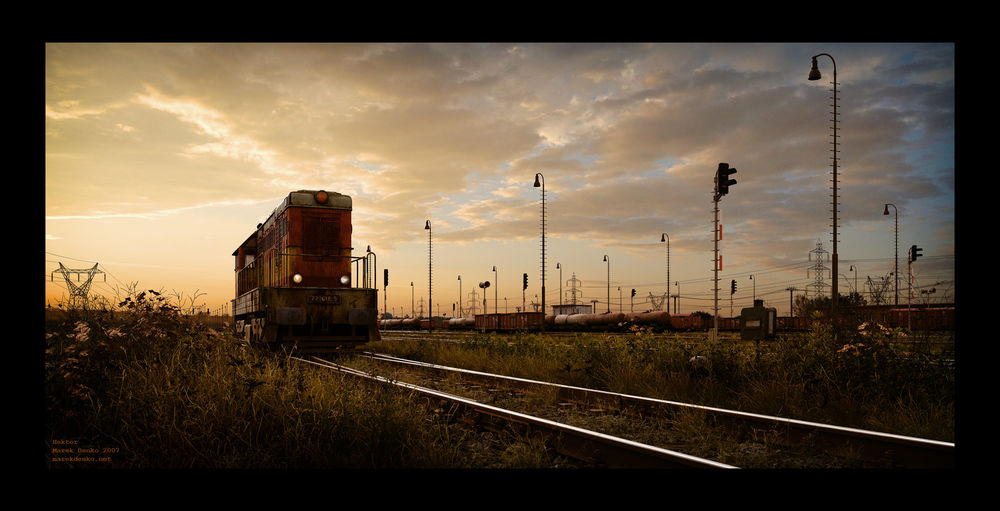 Обои для рабочего стола Поезд стоит на станции, вокруг пожелтевшая трава, художник Marek Denko / Марек Денко