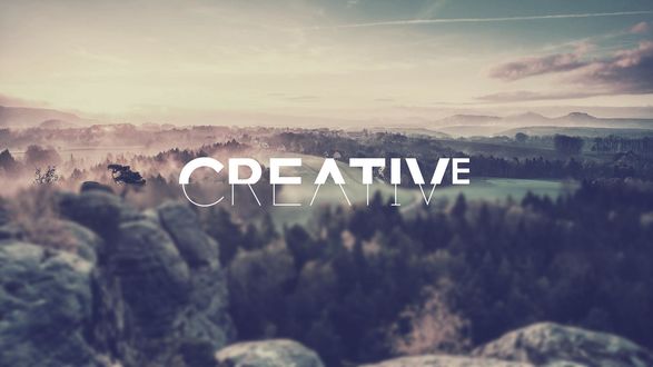 Обои на рабочий стол Надпись Creative / Творчество на фоне леса и гор
