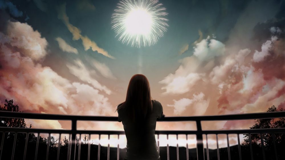 Обои для рабочего стола Девушка стоит на мосту, смотря на фейерверк в небе