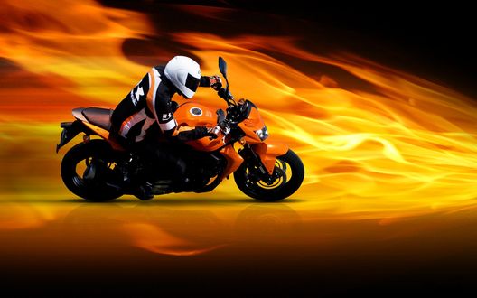 Обои на рабочий стол Парень едет на мотоцикле Kawasaki z750 / Кавасаки Зет 750 по дороге на фоне огня