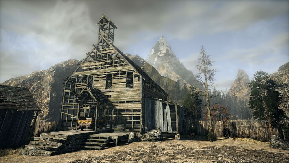 Обои для рабочего стола Заброшенное здание на фоне гор, из игры Alan Wake