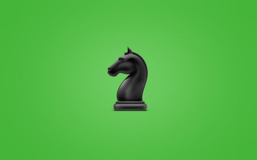 Обои на рабочий стол Черная фигура шахматной фигуры коня на зеленом фоне