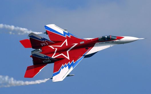 Обои на рабочий стол Военный самолет МИГ - 29 летит в небе