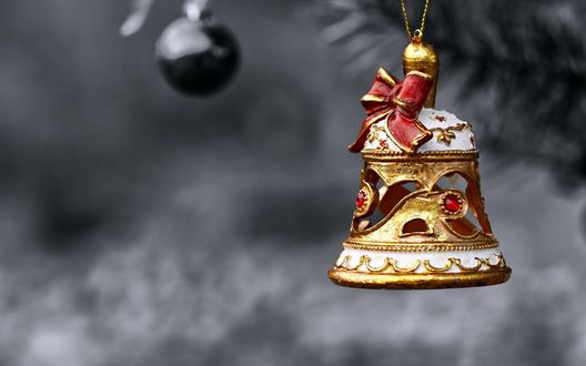 Обои на рабочий стол Игрушечный колокольчик на темно-сером фоне