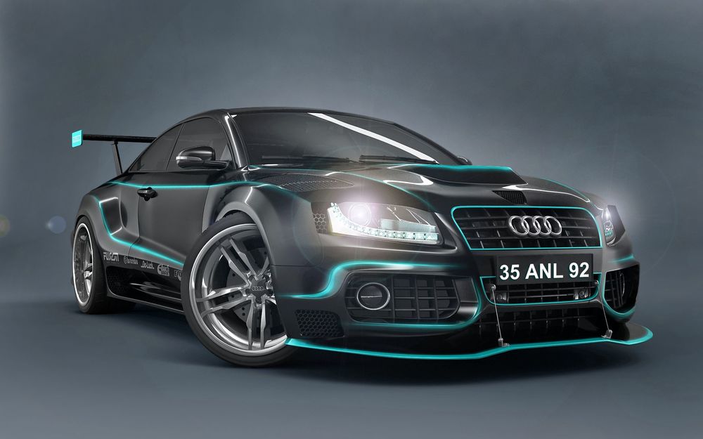 Обои для рабочего стола Машина марки AUDI стоит с включенными фарами и синей неоновой подсветкой по кузову