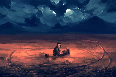Обои на рабочий стол Черноволосый мальчик, сидящий на песке рядом с ведерком и совком, сделавший из песка песчаный замок на фоне гор и пасмурного неба