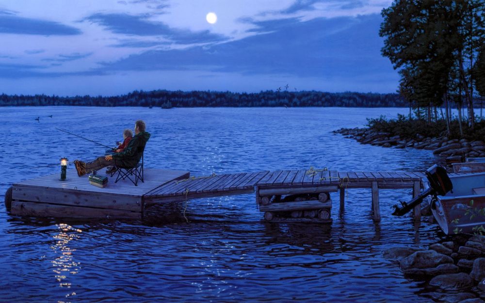 Обои для рабочего стола Отец с сыном, сидящие с удочками в руках на деревянном мостике у берега озера на фоне вечернего небосклона с взошедшей луной на пасмурном небосклоне, у каменистого берега стоит моторная лодка с поднятым двигателем