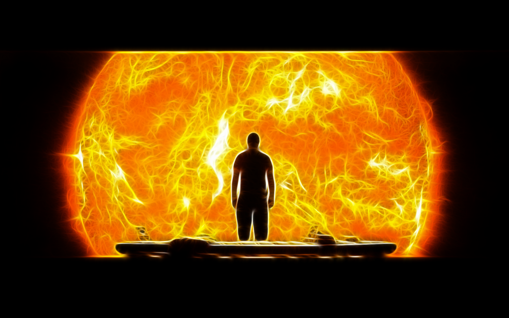 Обои для рабочего стола Мужчина стоит на фоне огромного Солнца с огненными протуберанцами