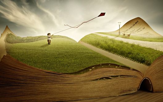 Обои на рабочий стол На страницах раскрытой книги, мальчик на зеленом лугу запускает воздушного змея