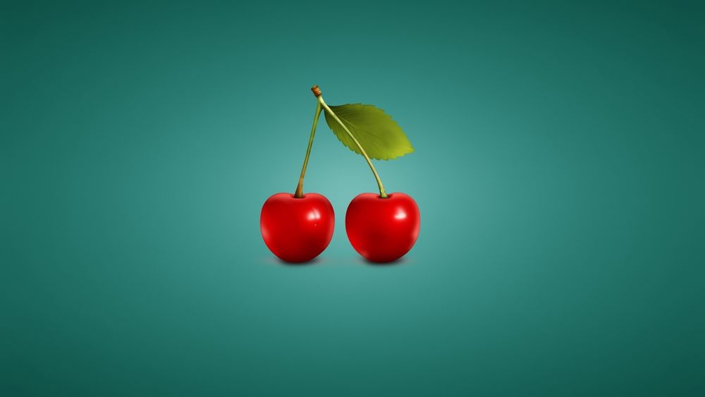 Обои для рабочего стола Две красные вишни с листом на зеленом фоне