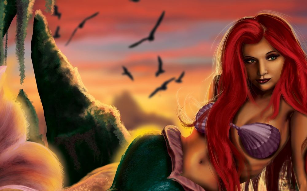 Обои для рабочего стола Ариэль / Ariel из мультфильма Русалочка / The little marmaid лежит на песке на фоне неба и птиц