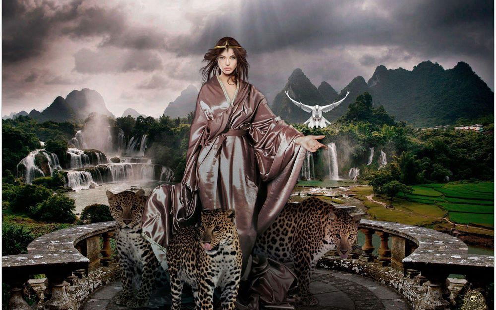 Обои для рабочего стола Девушка в шелковом халате стоит на фоне местности с горами, водопадами, лесами, полями, на каменной террасе здания с тремя леопардами и ей на руку садится белый голубь