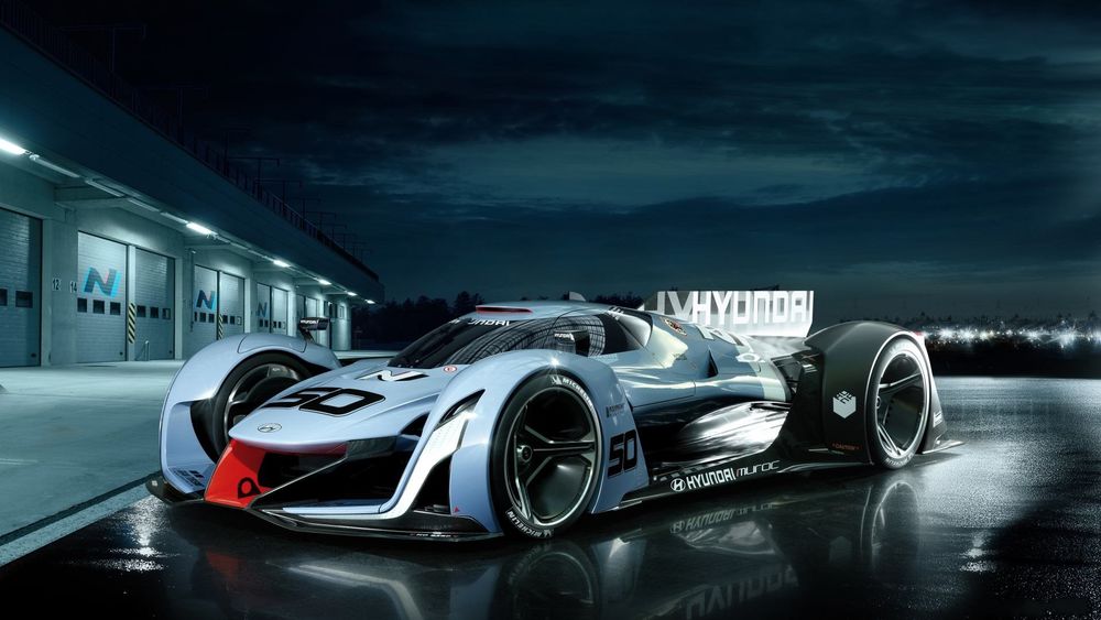 Обои для рабочего стола Машина марки Hyundai Vision Gran Turismo, Concept на фоне ночного города