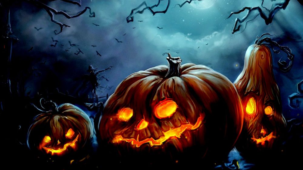 Обои для рабочего стола Свечки, горящии в тыквенных головах в ночь на halloween